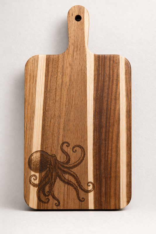 Wooden cutting board with an engraved octopus design on a light gray background